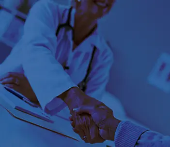 People shaking hands in labcoats